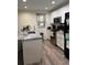 Well-lit kitchen featuring stainless steel appliances and marble countertops at 1403 Hidden Creek Ln, Winter Haven, FL 33880