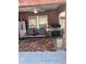 Covered patio with a ceiling fan, seating, a grill, and brick accents at 1403 Hidden Creek Ln, Winter Haven, FL 33880