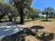 Spacious yard with mature trees, offering natural beauty and plenty of room for outdoor activities at 180 Old Connersville Rd, Bartow, FL 33830