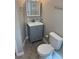 Cozy bathroom features a modern vanity, sink, toilet, and updated fixtures at 180 Old Connersville Rd, Bartow, FL 33830