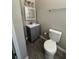 Cozy bathroom features a modern vanity, sink, toilet, and updated fixtures at 180 Old Connersville Rd, Bartow, FL 33830