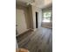 Bedroom with wood-look flooring, closet and ample natural light at 180 Old Connersville Rd, Bartow, FL 33830