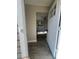View from the doorway of newly renovated living room with gray flooring and updated decor at 180 Old Connersville Rd, Bartow, FL 33830