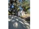 Charming single-story home boasts mature trees and a long driveway at 180 Old Connersville Rd, Bartow, FL 33830