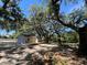 Cozy cottage with new deck, perfectly situated among majestic trees, offering privacy and charm at 180 Old Connersville Rd, Bartow, FL 33830