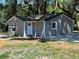 Cozy gray home with a white front door, newly renovated at 180 Old Connersville Rd, Bartow, FL 33830
