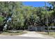 Charming renovated home with a gray exterior and a circular driveway at 180 Old Connersville Rd, Bartow, FL 33830
