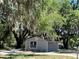 Charming renovated home with a gray exterior and mature trees at 180 Old Connersville Rd, Bartow, FL 33830