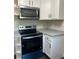 Kitchen featuring modern appliances, including a stainless steel oven and microwave at 180 Old Connersville Rd, Bartow, FL 33830