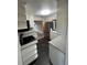 Modern kitchen featuring stainless appliances, dark floors, and ample cabinetry at 180 Old Connersville Rd, Bartow, FL 33830