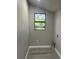 Bright laundry room features wood-look flooring, a black framed window, and hookups at 180 Old Connersville Rd, Bartow, FL 33830