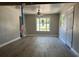 Living room with gray wood flooring, ceiling fan, and recessed lighting at 180 Old Connersville Rd, Bartow, FL 33830