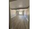 Living room featuring gray flooring, new interior paint, and dining area at 180 Old Connersville Rd, Bartow, FL 33830
