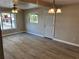 Living room featuring gray flooring, ceiling fan, and lots of natural light at 180 Old Connersville Rd, Bartow, FL 33830