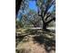 Expansive lot featuring mature trees providing ample shade and a tranquil setting at 180 Old Connersville Rd, Bartow, FL 33830