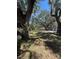 Tranquil property featuring mature trees, creating a private and peaceful setting at 180 Old Connersville Rd, Bartow, FL 33830