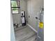 This utility room features connections for washer/dryer and an adjacent water heater at 180 Old Connersville Rd, Bartow, FL 33830