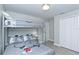 Comfortable bedroom with a bunk bed, Mickey Mouse-themed bedding, and wood-look tile floors at 1942 Bermuda Pointe Dr, Haines City, FL 33844