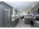 Well-equipped kitchen showcases stainless steel appliances, granite countertops, and tile flooring at 1942 Bermuda Pointe Dr, Haines City, FL 33844