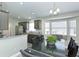 Open concept kitchen and dining area featuring updated cabinetry and stainless steel appliances at 1942 Bermuda Pointe Dr, Haines City, FL 33844