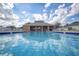 Community pool and clubhouse with bright blue pool water perfect for recreational enjoyment at 1942 Bermuda Pointe Dr, Haines City, FL 33844