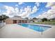 Expansive community pool with surrounding deck and clubhouse providing a perfect recreational space at 1942 Bermuda Pointe Dr, Haines City, FL 33844
