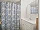 Bathroom featuring white vanity and shower with a blue floral curtain at 2055 S Floral Ave # 42, Bartow, FL 33830