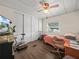 Functional bedroom space with natural light, ceiling fan, and wood floors at 2055 S Floral Ave # 42, Bartow, FL 33830