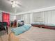 Bedroom with white ceilings, neutral walls, ceiling fan, and built in storage at 2055 S Floral Ave # 42, Bartow, FL 33830
