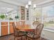 Cozy dining nook with a round table, wood floors, and natural light at 2055 S Floral Ave # 42, Bartow, FL 33830