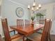 Dining room featuring a chandelier and seating for six at 2055 S Floral Ave # 42, Bartow, FL 33830