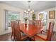 Dining room with wood floors and table with seating for six at 2055 S Floral Ave # 42, Bartow, FL 33830