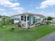 Beautiful home with manicured lawn and colorful potted plants accentuating the facade at 2055 S Floral Ave # 42, Bartow, FL 33830
