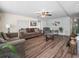 Inviting living room with wood floors, comfortable seating, and attractive decor at 2055 S Floral Ave # 42, Bartow, FL 33830
