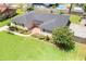 Aerial view of a single-story house, with new roof, landscaping, and brick pathway at 2096 Lake Ariana Blvd, Auburndale, FL 33823