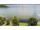 Scenic aerial view of lake with docks and lush greenery at 2096 Lake Ariana Blvd, Auburndale, FL 33823