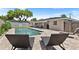 Backyard featuring an in-ground pool, brick pavers, and modern patio furniture at 2096 Lake Ariana Blvd, Auburndale, FL 33823