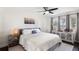 Cozy bedroom with neutral tones, ceiling fan, and views to outside at 2096 Lake Ariana Blvd, Auburndale, FL 33823
