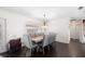 Dining room with a modern chandelier and furniture set and views to the outdoors, a perfect space for hosting dinners at 2096 Lake Ariana Blvd, Auburndale, FL 33823