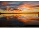 Beautiful sunset view over the tranquil lake reflecting colorful clouds and sky at 2096 Lake Ariana Blvd, Auburndale, FL 33823