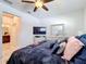 Spacious bedroom with neutral colors, a television, and a mirrored dresser at 229 Elm Ct, Kissimmee, FL 34759