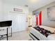 A bedroom featuring closet space and a view into an adjacent room at 229 Elm Ct, Kissimmee, FL 34759