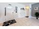 Bright foyer with tile flooring and a decorated front door at 229 Elm Ct, Kissimmee, FL 34759