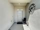 Inviting front porch with textured walls, white door, and decorative star at 229 Elm Ct, Kissimmee, FL 34759