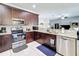 Well-equipped kitchen with stainless steel appliances and granite countertops, offering both style and functionality at 229 Elm Ct, Kissimmee, FL 34759