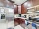 Modern kitchen design features stainless steel appliances and well-organized storage, enhancing usability at 229 Elm Ct, Kissimmee, FL 34759