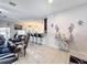 Open living space with tile flooring, eat in bar, and modern finishes at 229 Elm Ct, Kissimmee, FL 34759