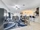 Open-concept living room and kitchen with modern design and fixtures at 229 Elm Ct, Kissimmee, FL 34759