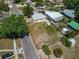 Aerial view of the house and the lot including some neighborhood streets and houses at 2301 Freemason St, Lakeland, FL 33801