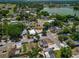 Aerial view of the property's location within a residential neighborhood and in close proximity to a lake at 2301 Freemason St, Lakeland, FL 33801